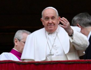 Pope Francis waves from the balcony at St Peter's, Rome